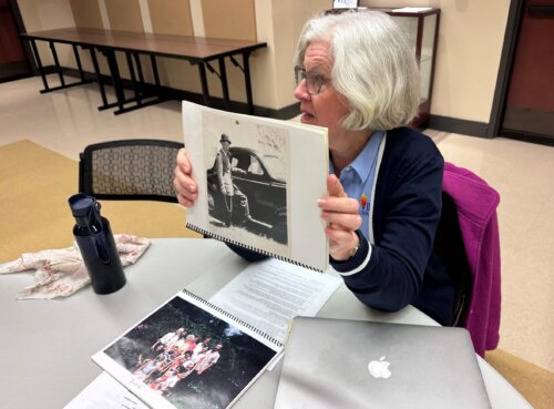 With a photo of her Uncle. 
